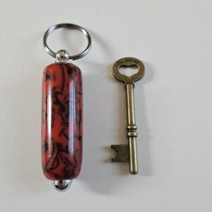 R/porte clés tourné en résine rouge et noir