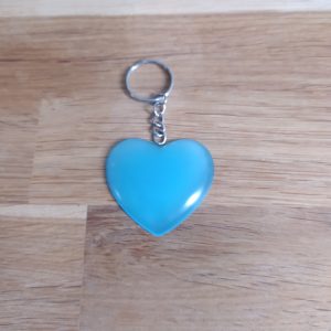 R/porte clés coeur bleu phosphorescent