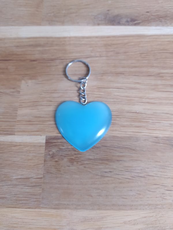 R/porte clés coeur bleu phosphorescent