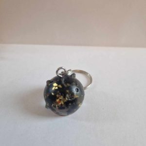 R/porte clés boule opaque cochon feuilles noires feuilles or