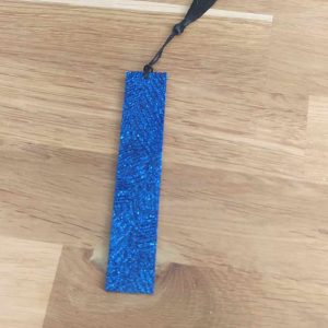 R/marque pages bleu pailleté effet feuilles pompon noir