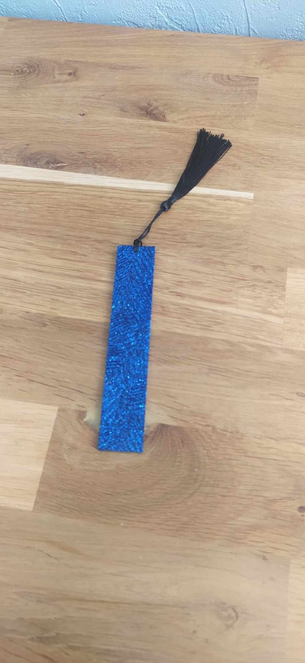 R/marque pages bleu pailleté effet feuilles pompon noir