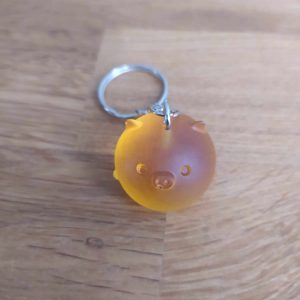 R/porte clés boule animaux cochon orange cristal