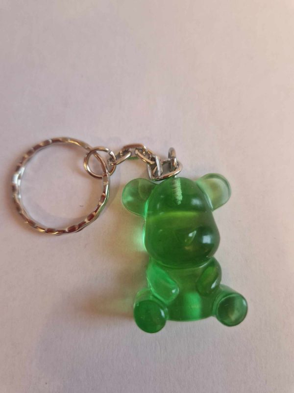 R/porte clés petit ourson assis cristal vert
