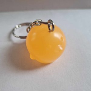 R/porte clés boule animaux opaque poussin saumon