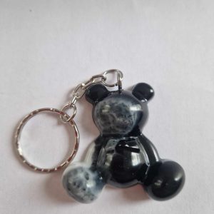 R/porte clés moyen ourson pattes noir et blanc