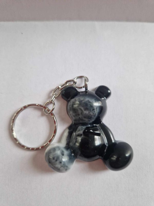 R/porte clés moyen ourson pattes noir et blanc