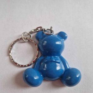 R/porte clés moyen ourson pattes rondes bleues opaques