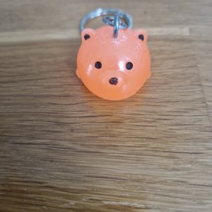 R/Porte clés boule animaux ours orange fluo (traits dessinés)