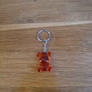 R/porte clés petit ourson assis orange
