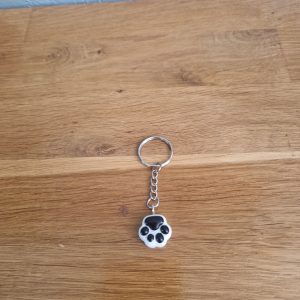R/porte clés pattes de chat noir et blanc