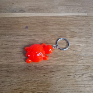 R/porte clés tortue orange fluo