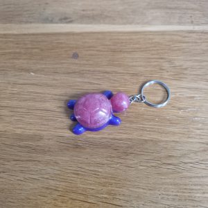 R/porte clés tortue rose violet